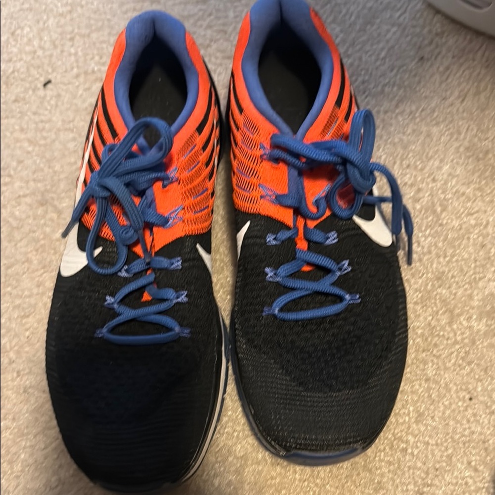 Nike Black and Orange Sneakers with Sleek Design